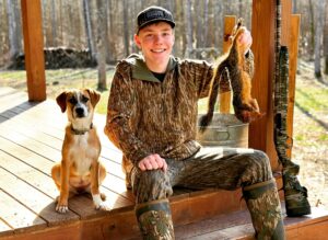 young squirrel dog hunting alone in the woods